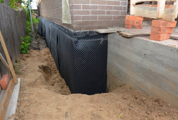 Happy homeowners after waterproofing job in Smyrna